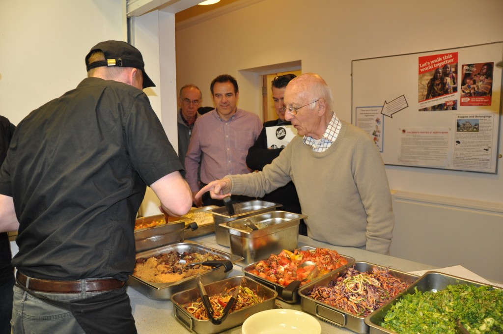 Committee Members, Bill Tyler and Duncan Neill, eye the excellent food provided by Planet Organic